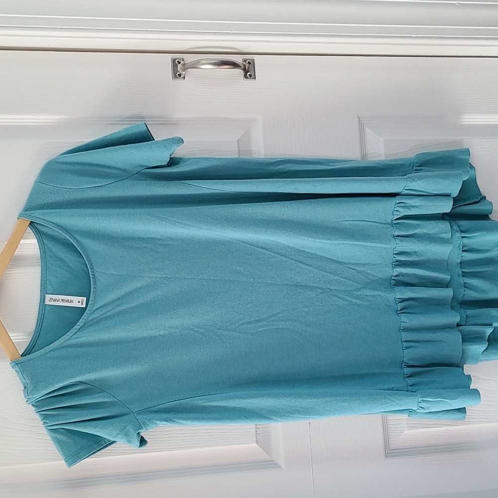 Short sleeve top, bought from a local boutique. Size Medium but it's oversized.